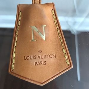 Louis Vuitton monogrammed tag “N”